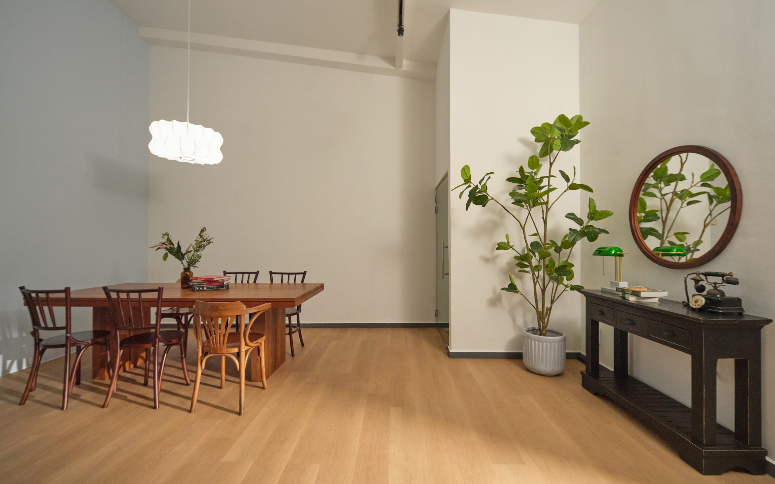 Bright shared lounge on an upper floor of a Figment coliving shophouse