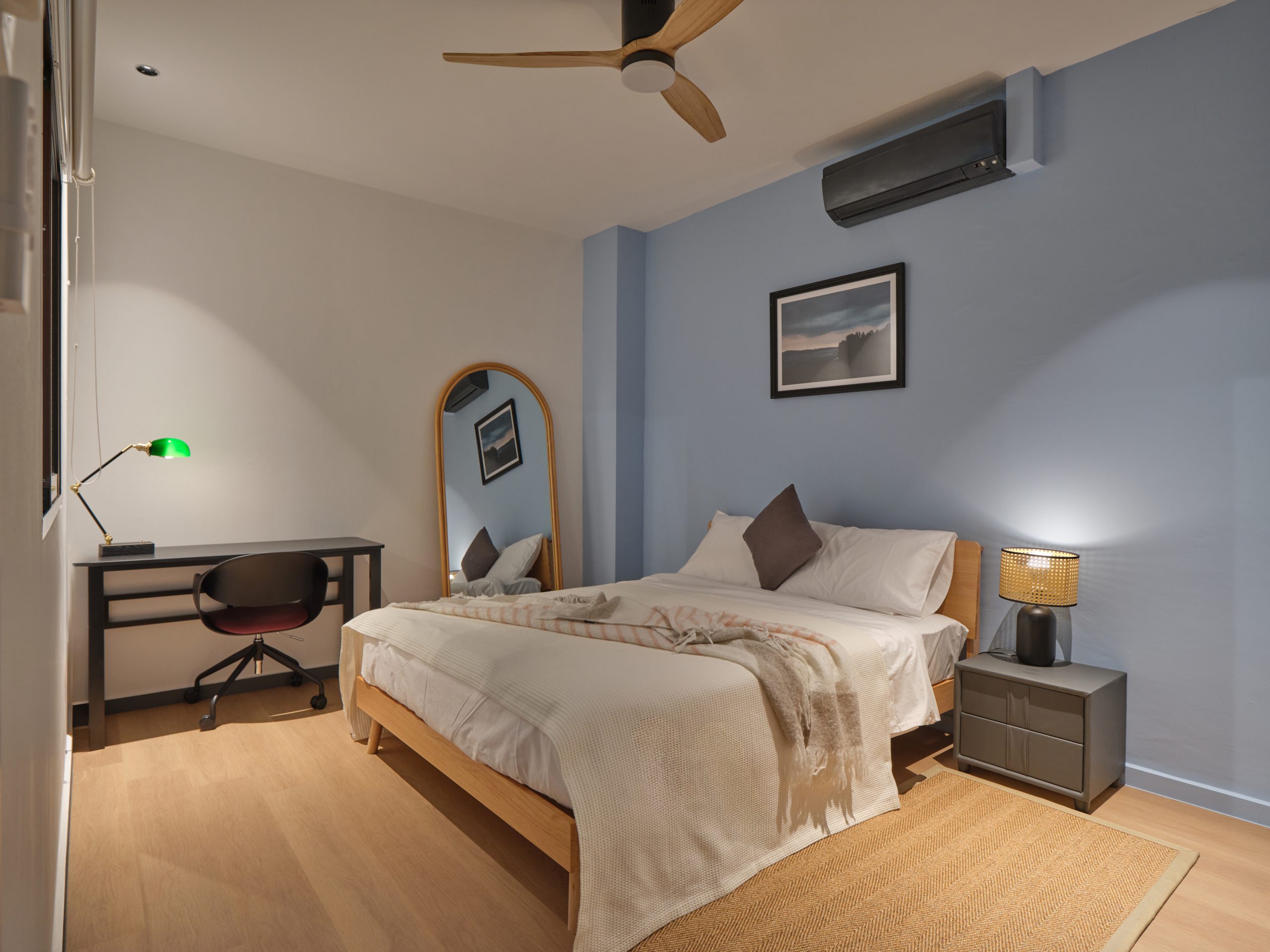 Air-conditioned bedroom at Wah Leong House, Figment’s heritage co-living shophouse in Singapore