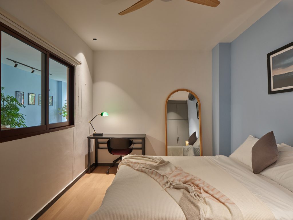 Bedroom in a restored landed heritage house managed by Figment in Singapore